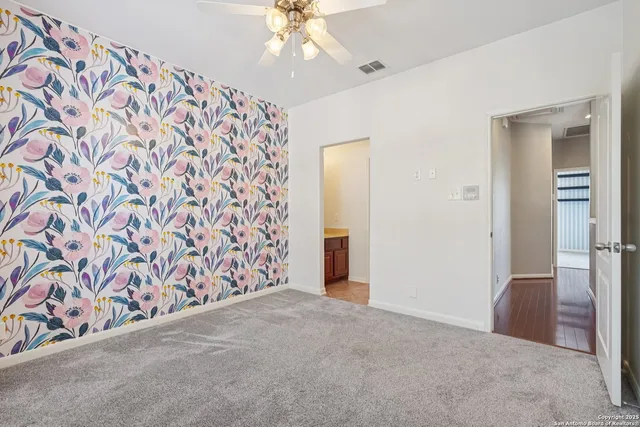 a view of a swimming pool with a table and chairs