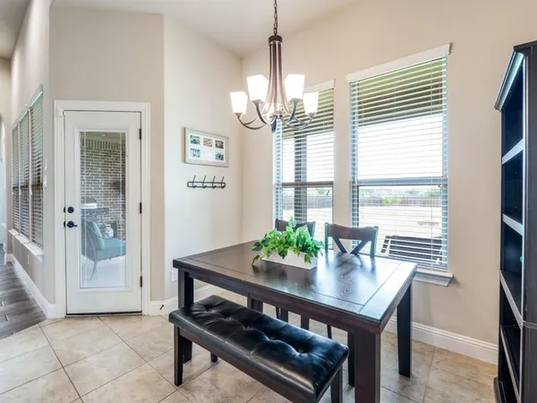 a view of a dining room with furniture and window