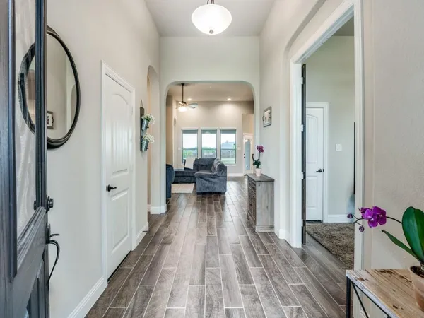 a view of a livingroom with furniture and entryway