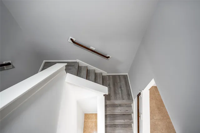 a view of a room with stairs and a window