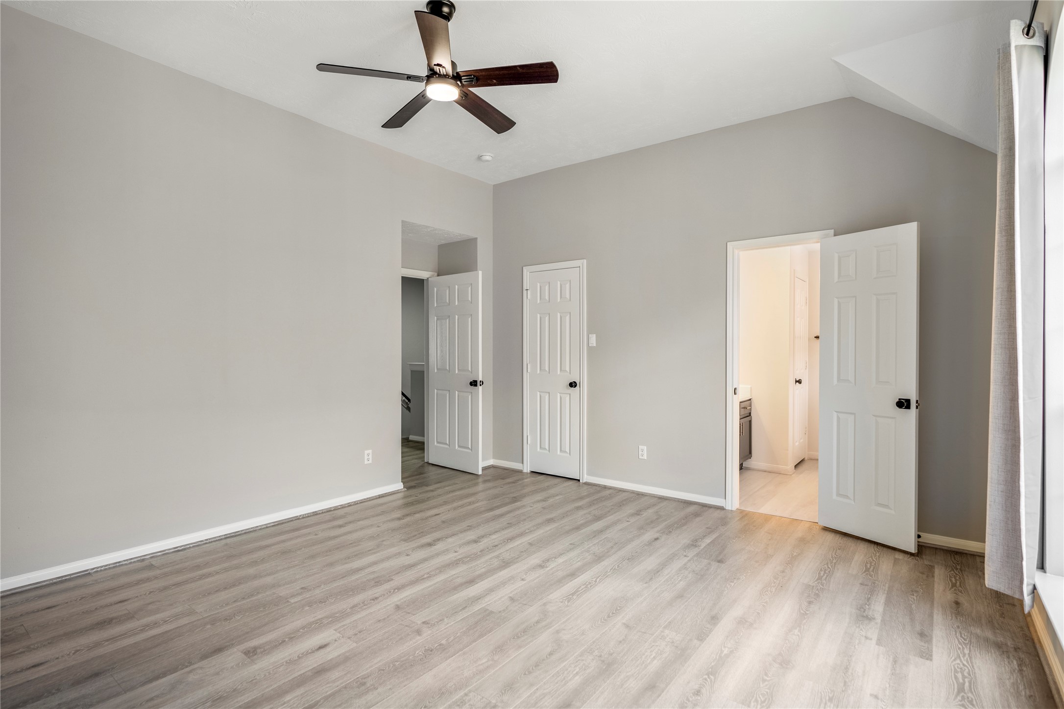 11735 Alief Clodine Road, Unit 20 Houston, TX 77072 - Photo 20 of 33 a view of room with hardwood floor and ceiling fan