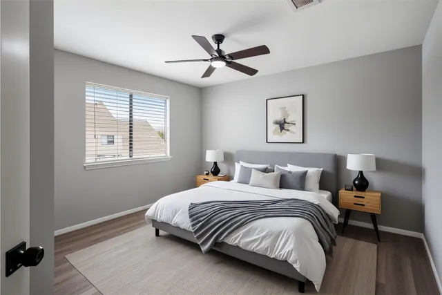 a bedroom with a bed and window