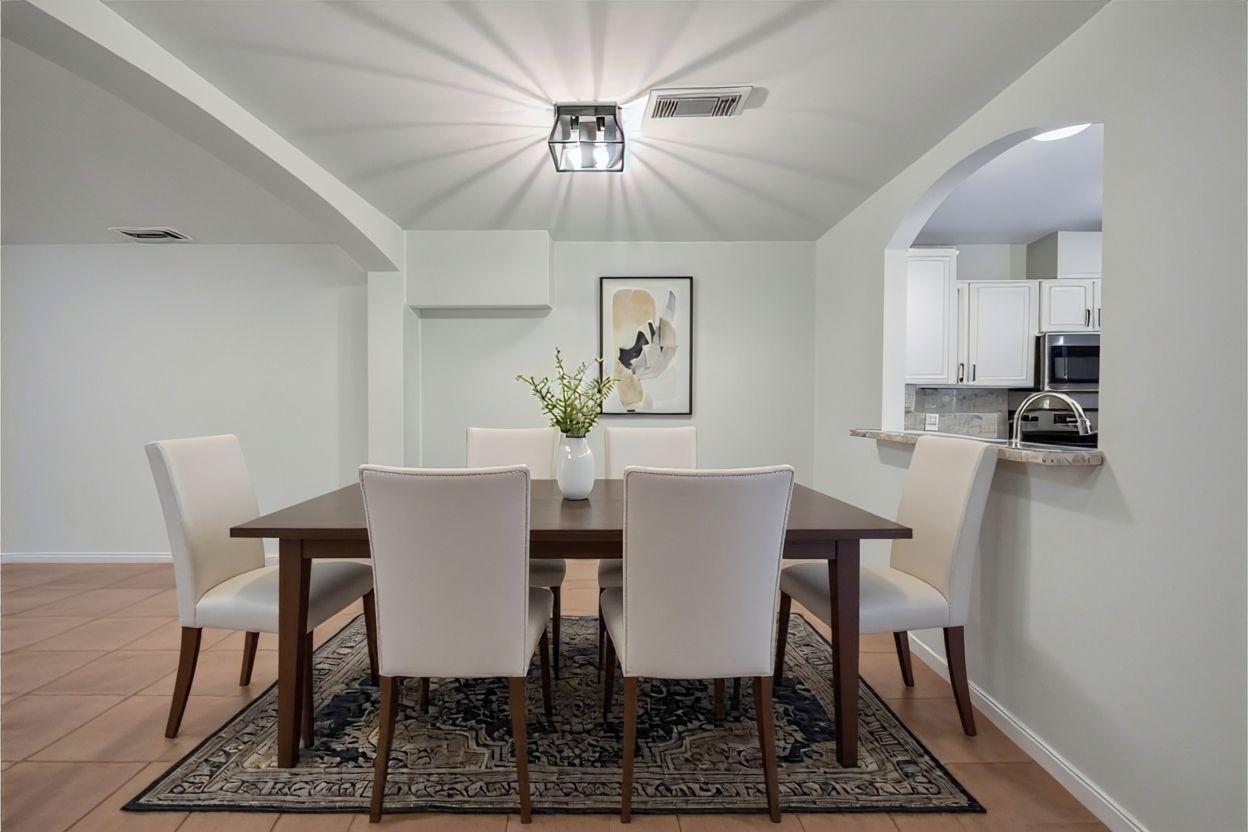 11735 Alief Clodine Road, Unit 20 Houston, TX 77072 - Photo 9 of 33 a view of a dining room with furniture and wooden floor