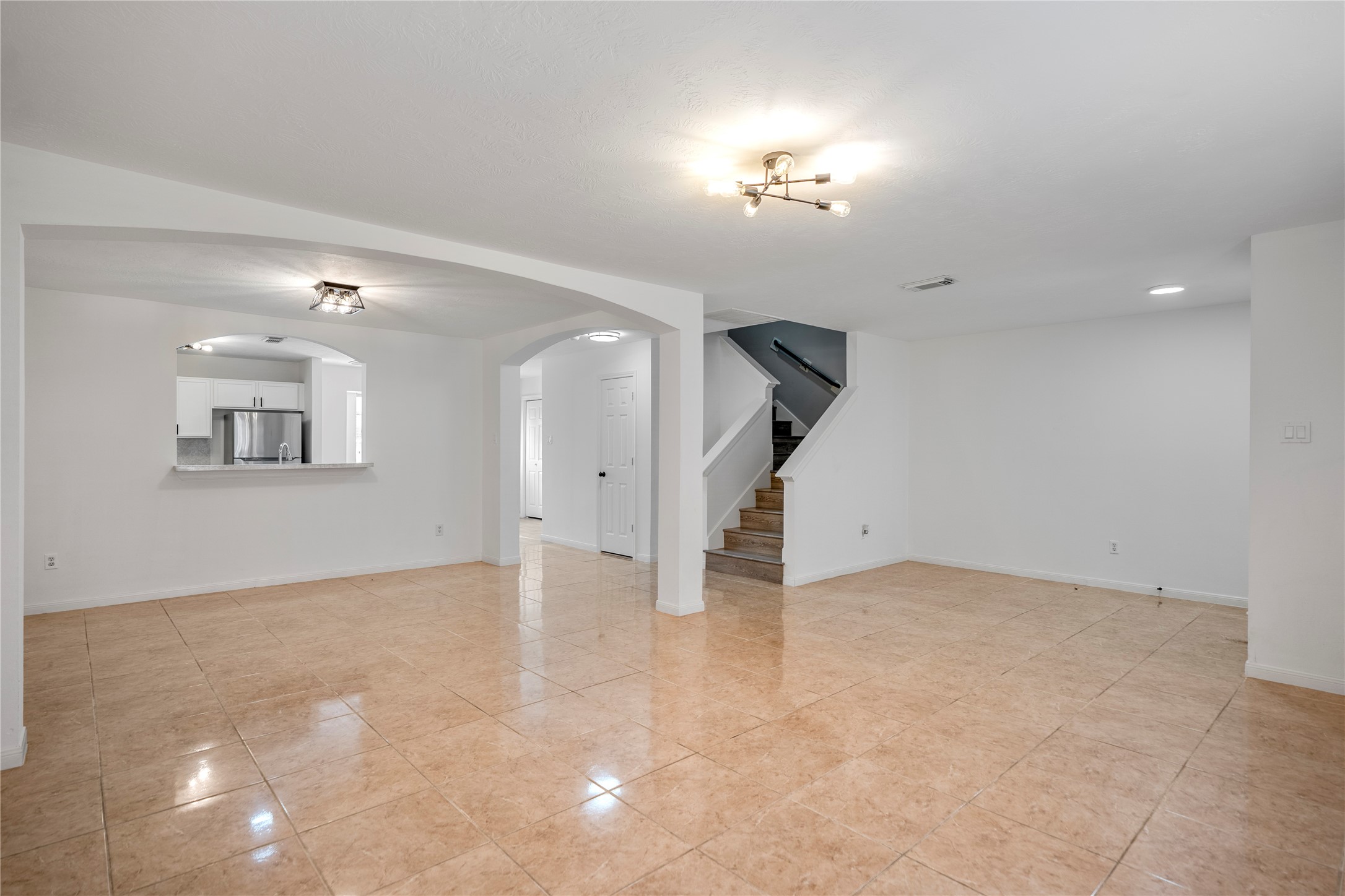 11735 Alief Clodine Road, Unit 20 Houston, TX 77072 - Photo 10 of 33 an empty room with chandelier fan and windows