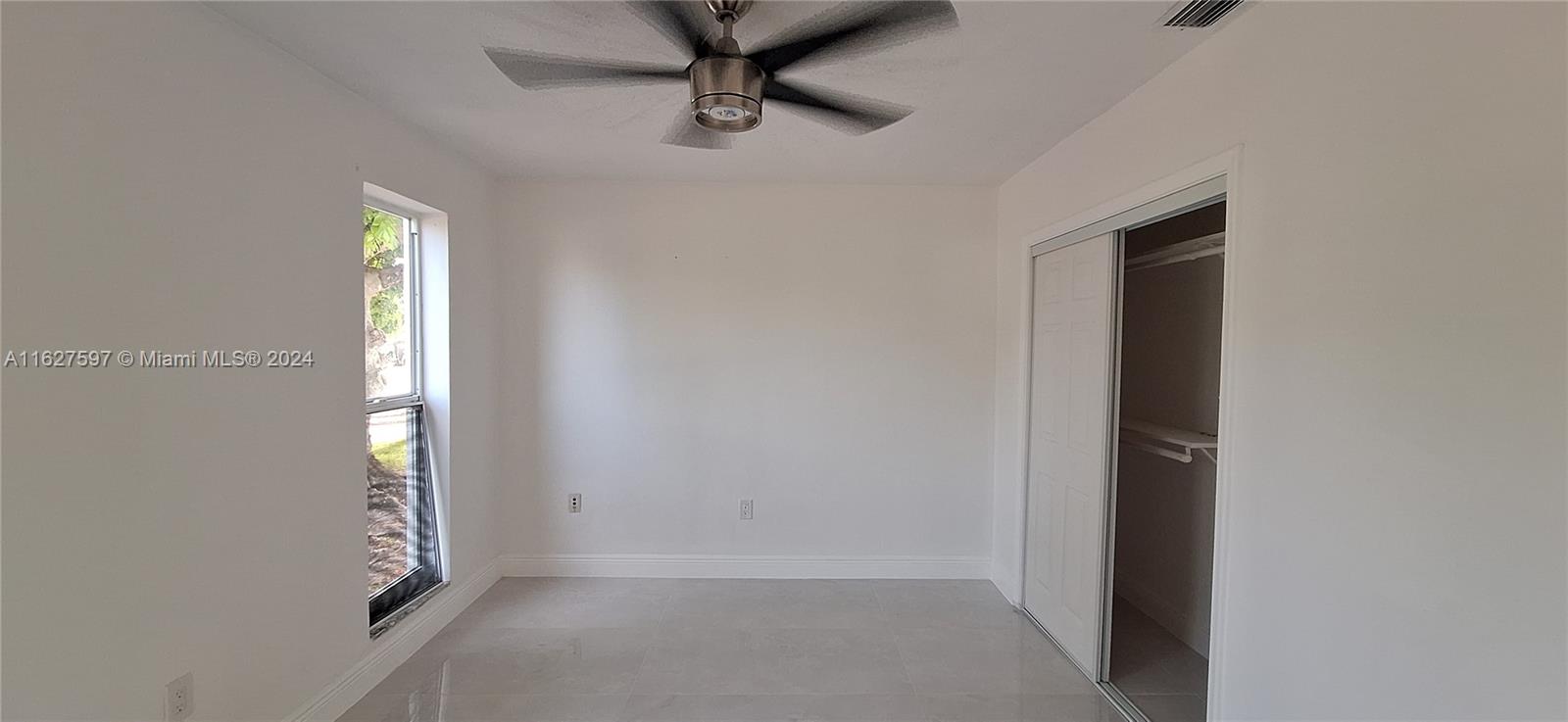 8620 Windsor Drive Miramar, FL 33025 - Photo 14 of 31 an empty room with windows and closet