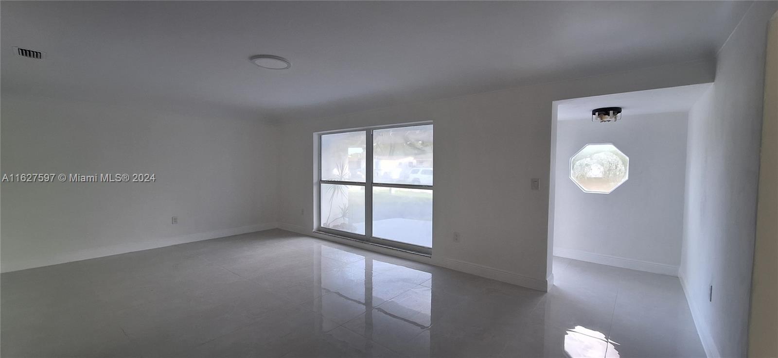 8620 Windsor Drive Miramar, FL 33025 - Photo 2 of 31 a view of an empty room with a window