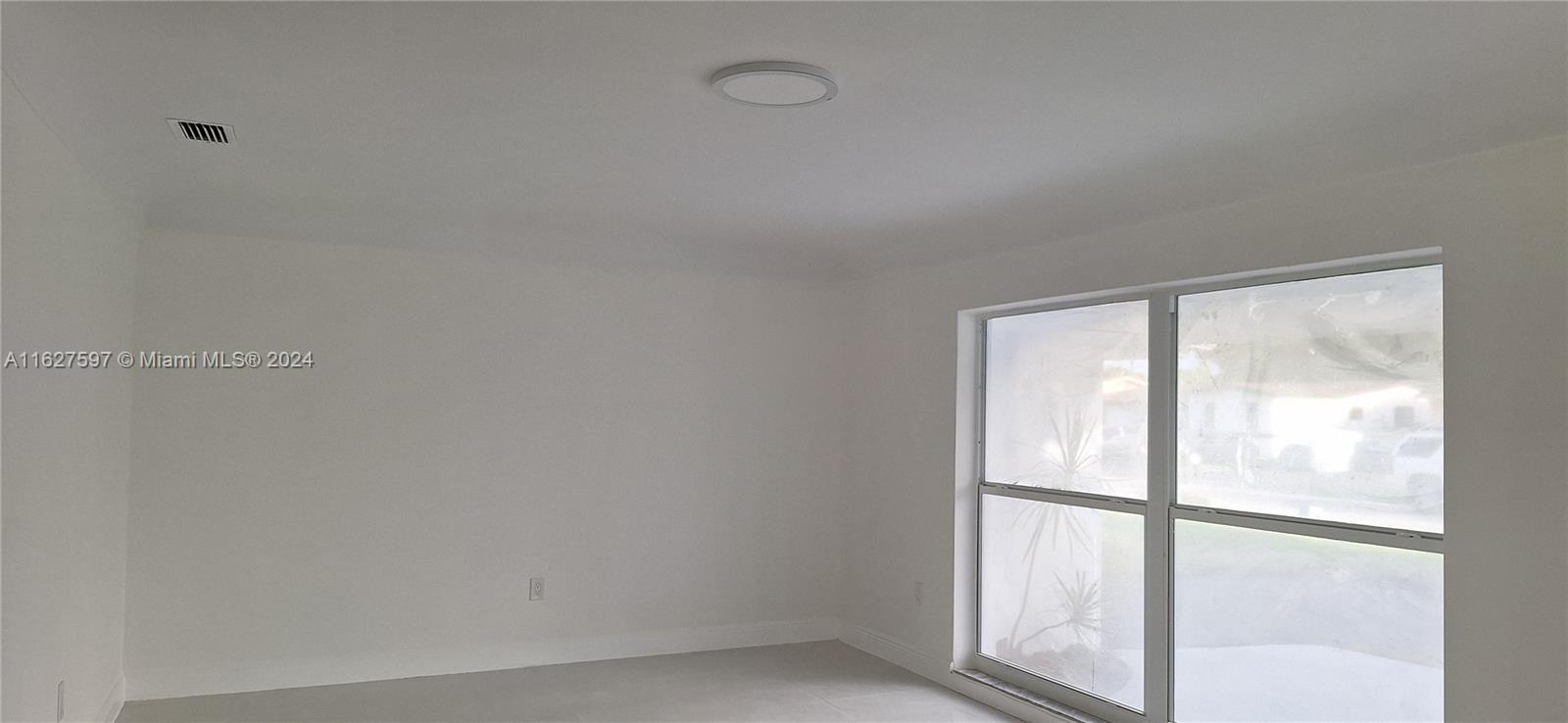 8620 Windsor Drive Miramar, FL 33025 - Photo 23 of 31 a view of a room that has a window