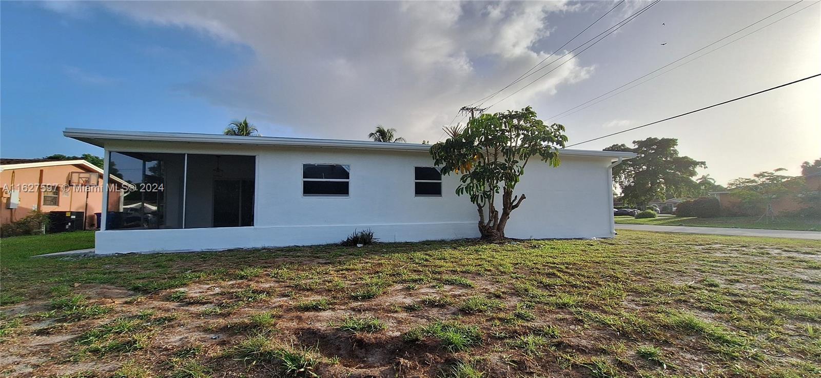 8620 Windsor Drive Miramar, FL 33025 - Photo 29 of 31 a view of a house with a yard
