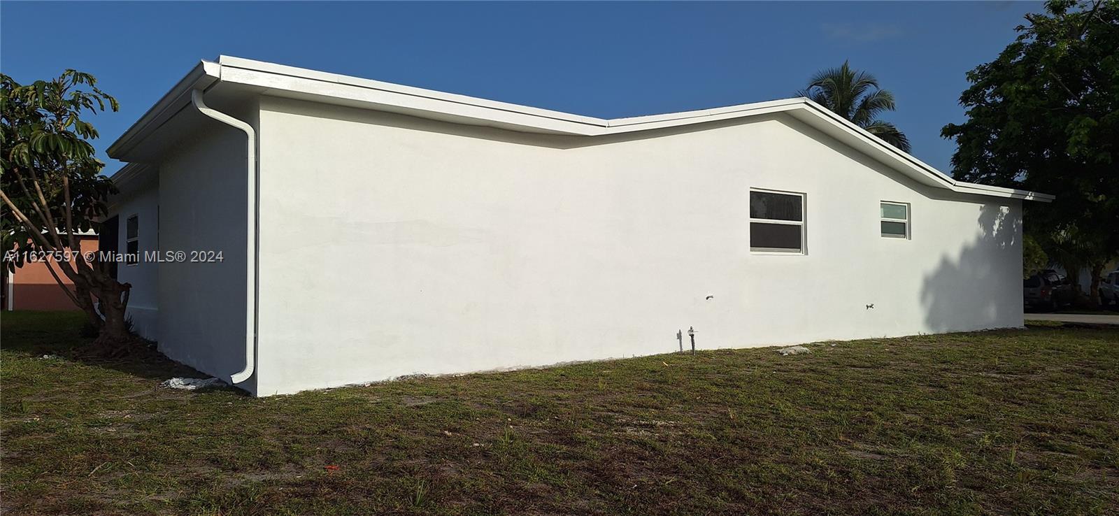 8620 Windsor Drive Miramar, FL 33025 - Photo 30 of 31 a house with a small yard