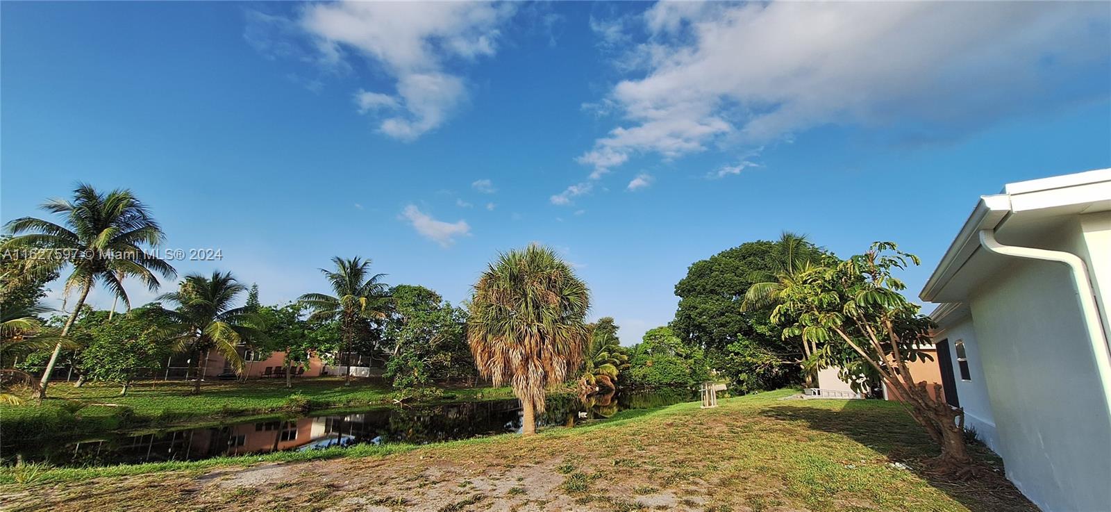 8620 Windsor Drive Miramar, FL 33025 - Photo 31 of 31 a view of a yard with palm trees