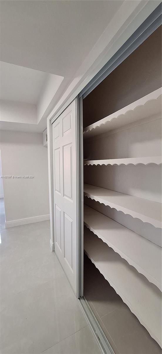 8620 Windsor Drive Miramar, FL 33025 - Photo 8 of 31 a view of walk in closet with empty racks