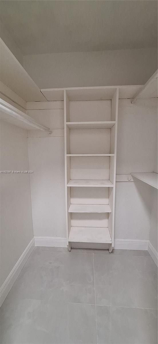 8620 Windsor Drive Miramar, FL 33025 - Photo 10 of 31 a view of walk in closet with empty racks