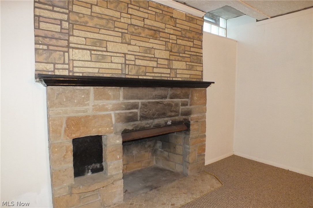 3844 Bethany Road Cleveland, OH 44118 - Photo 31 of 35 The stone fireplace on the lower level
