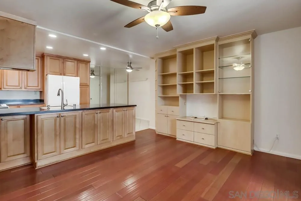 a view of kitchen with wooden floor and a window