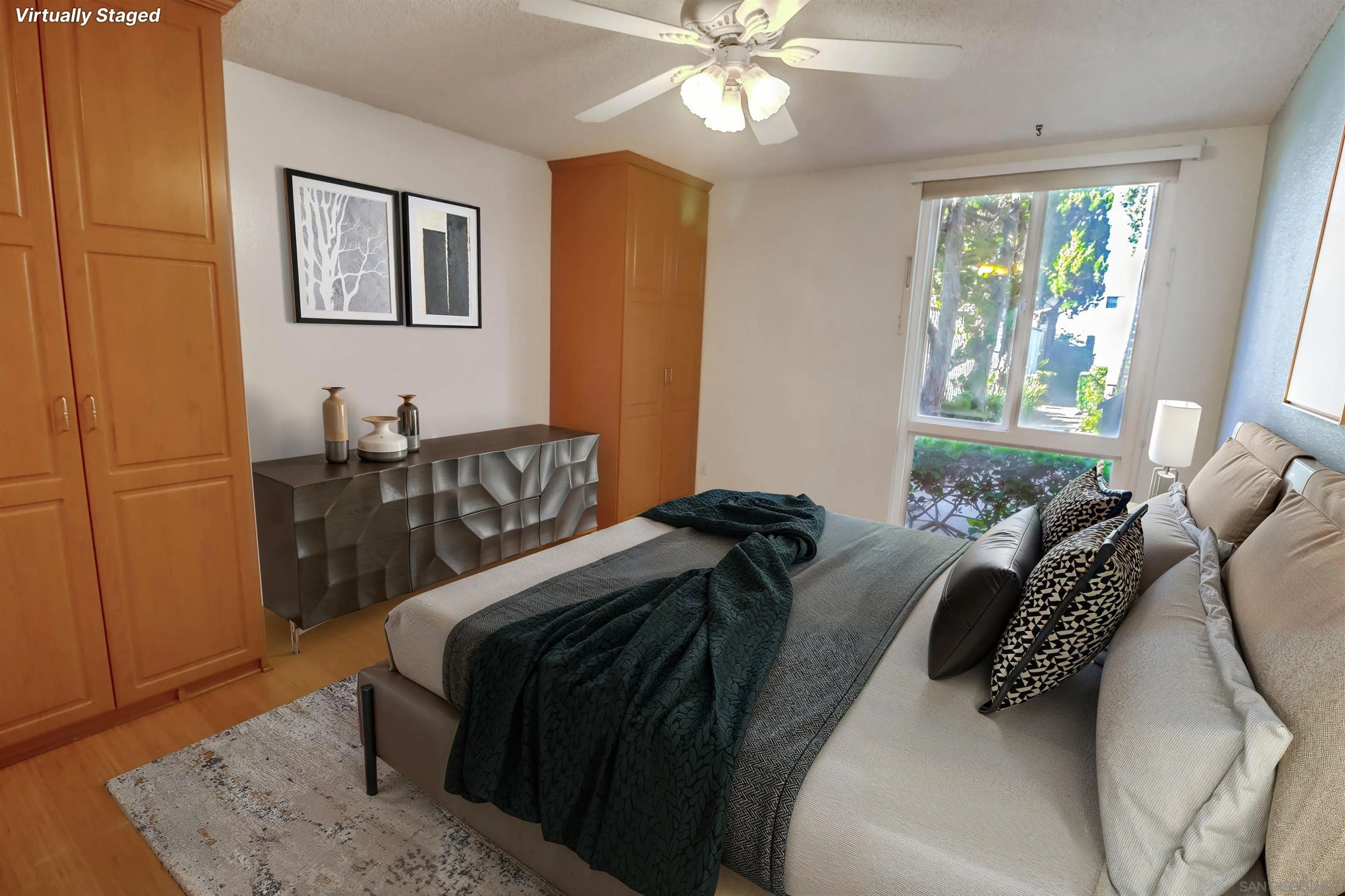 3333 Ruffin Road, Unit 4S San Diego, CA 92123 - Photo 18 of 34 a bedroom with a bed and wooden floor