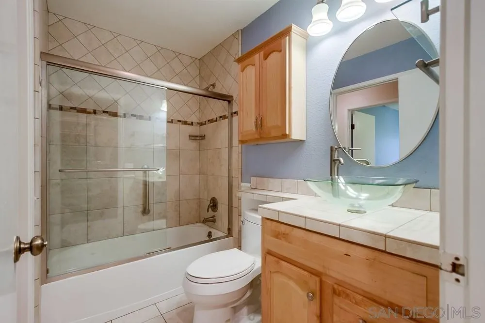 3333 Ruffin Road, Unit 4S San Diego, CA 92123 - Photo 23 of 34 a bathroom with a sink a toilet and shower