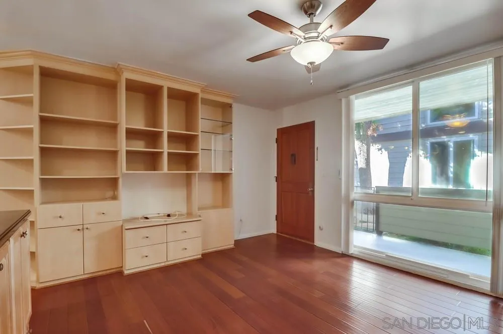 3333 Ruffin Road, Unit 4S San Diego, CA 92123 - Photo 5 of 34 a view of an empty room with a window and wooden floor