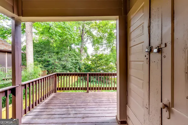 a view of balcony with wooden floor