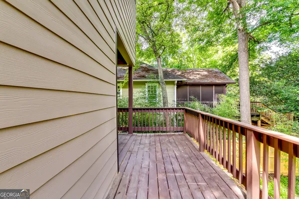 a view of a balcony with wooden floor