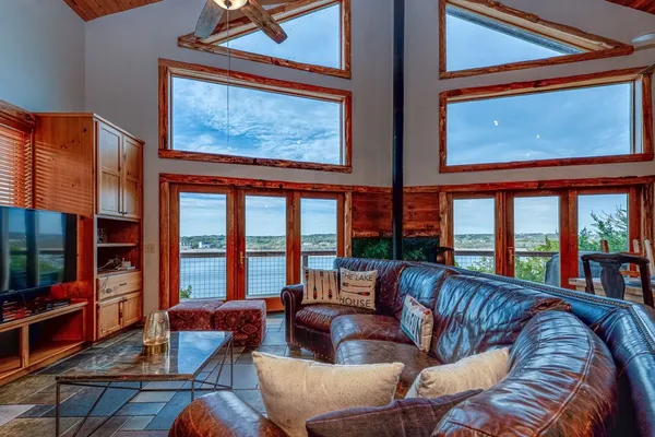 a living room with furniture and a large window