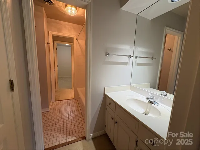 a bathroom with a sink a mirror and shower