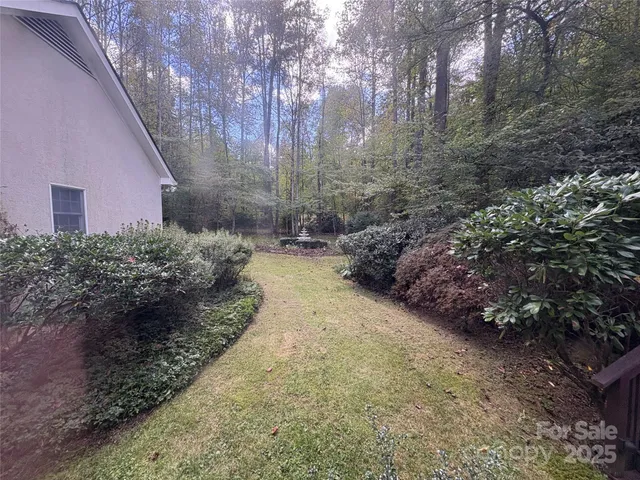a view of a pathway with a yard