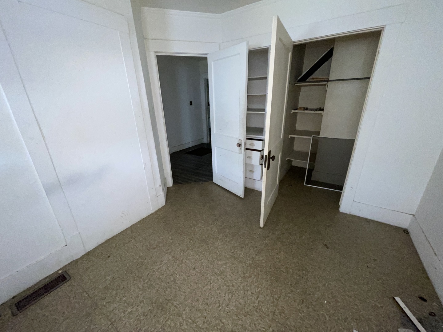 552 West Center Street Decatur, IL 62526 - Photo 16 of 26 a view of walk in closet with empty racks