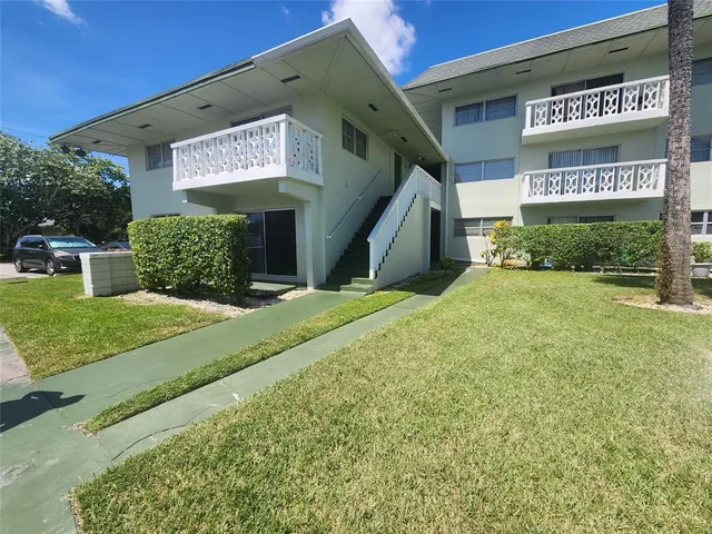 a view of a sign board with a yard