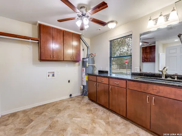 a bathroom with a sink and a large mirror