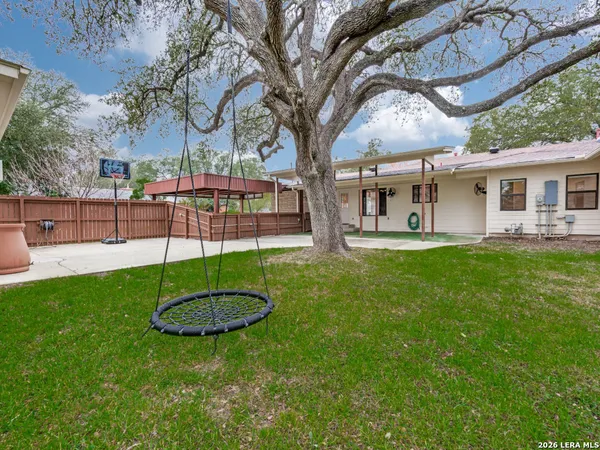 a house view with a sitting space and garden