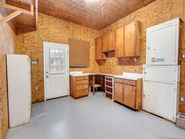 a kitchen with stainless steel appliances a refrigerator and a stove