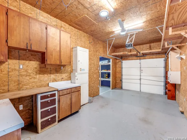 a view of a kitchen with storage and utility room