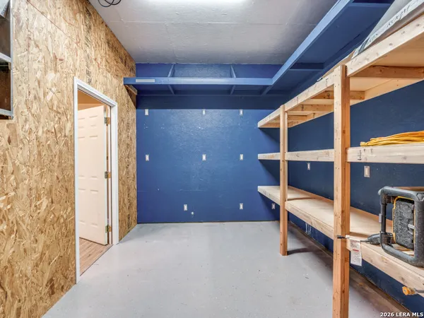 a view of workspace with wooden floor and windows