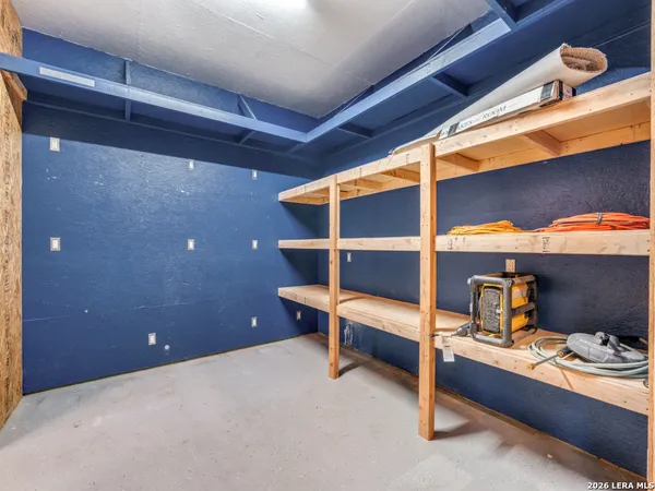 a room with furniture and lamp