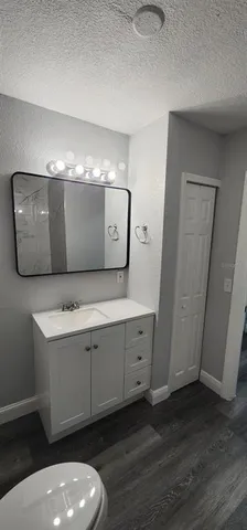 a bathroom with a sink and mirror