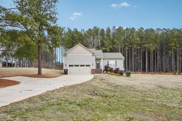 a view of a house with entryway and wooden floor