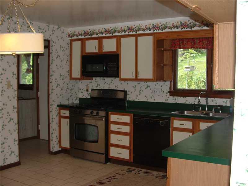 415 Thompson Run Road Pittsburgh, PA 15237 - Photo 7 of 16 Kitchen. The first floor laundry is off from the kitchen and also has an exit door to the deck.