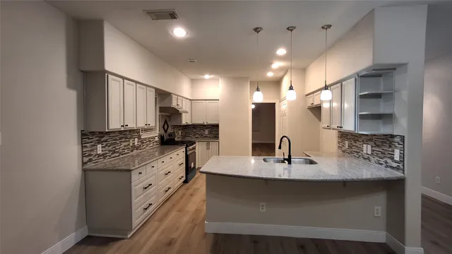 a bathroom with a sink double vanity and a mirror