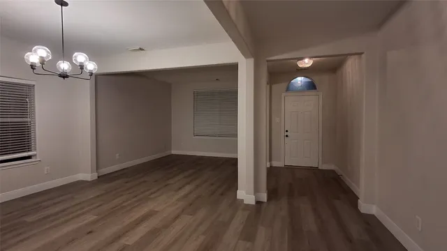 a view of a livingroom with wooden floor