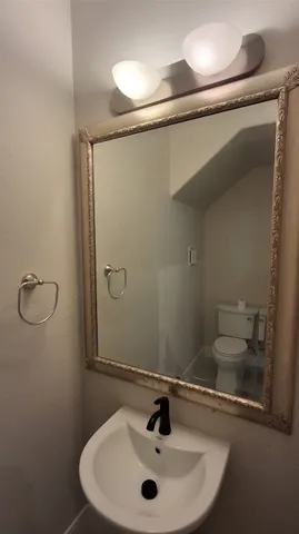 a bathroom with a sink and mirror