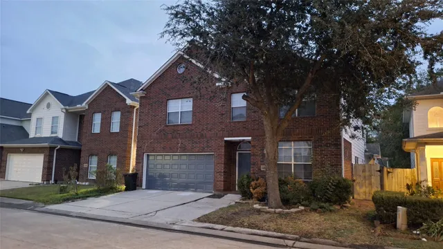a front view of a house with yard