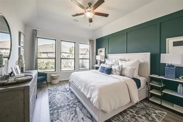 a bed room with a bed and a dresser