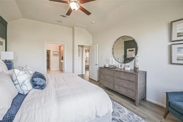 a spacious bathroom with a shower sink double vanity and mirror
