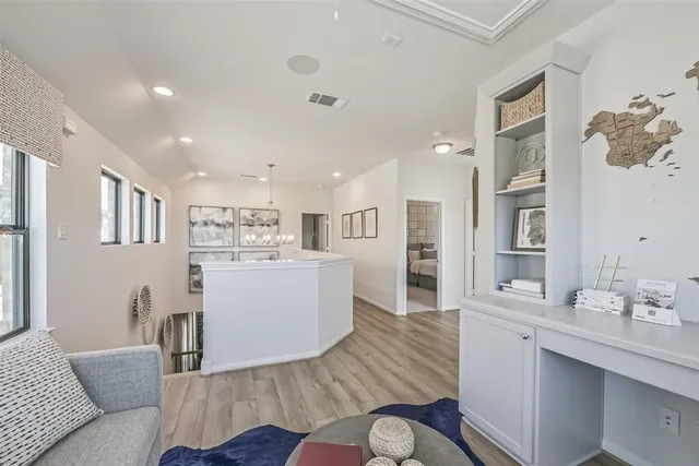 a bedroom with bed and a large window