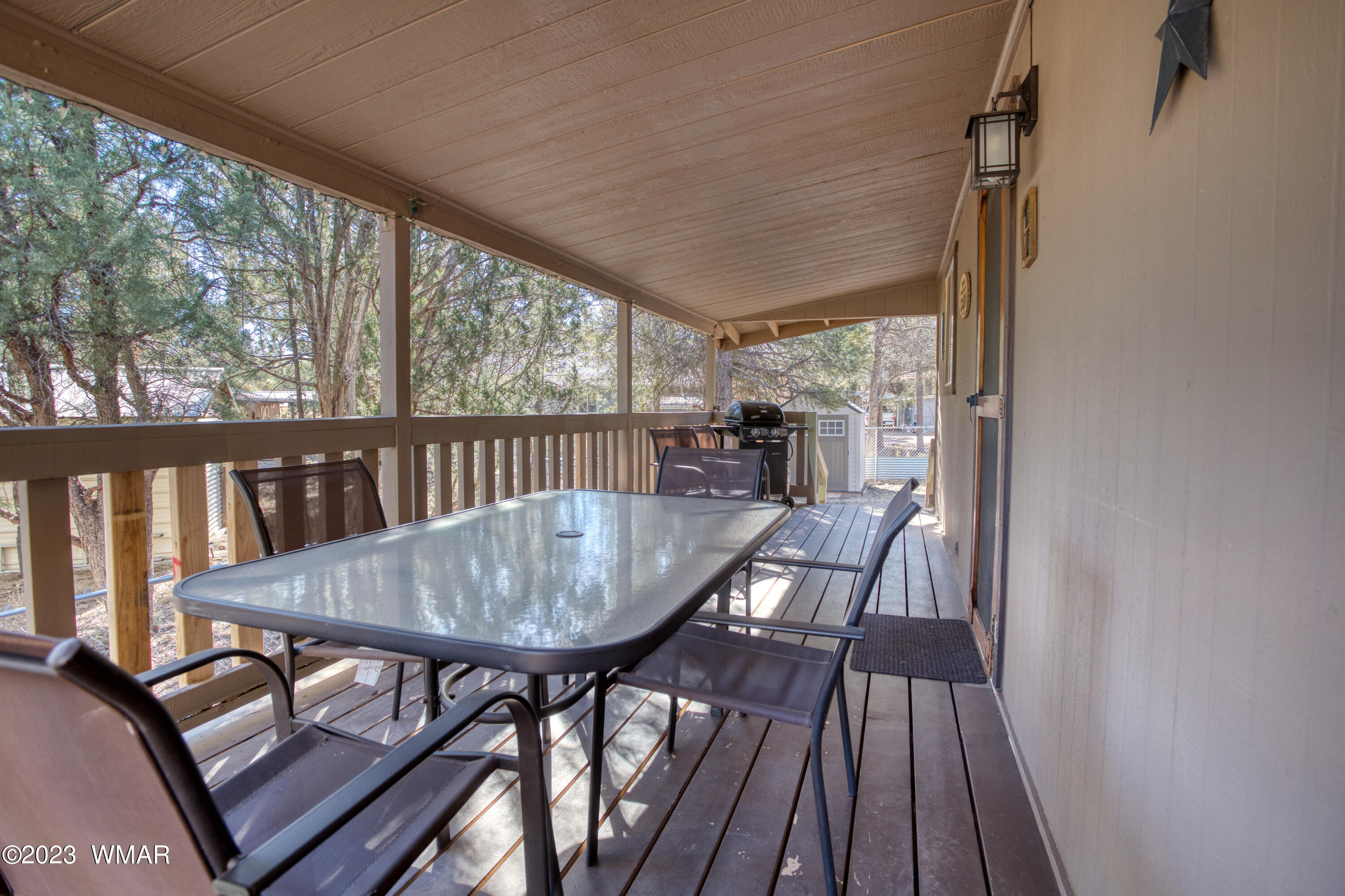 2129 Chevelon Road Overgaard, AZ 85933 - Photo 10 of 17 a view of a dining room with furniture window and wooden floor