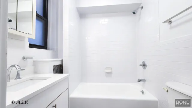 a bathroom with a sink and a bathtub