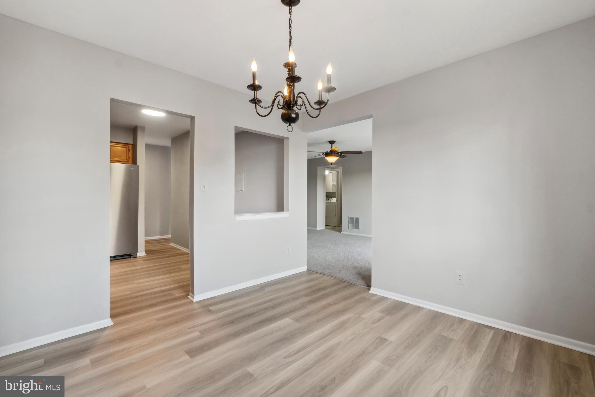 1003 Spring Gate Road, Unit 2B Catonsville, MD 21228 - Photo 13 of 27 Pass through window from dining room to kitchen