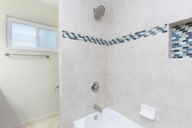 2480 Windmill View Road El Cajon, CA 92020 - Photo 17 of 22 Hall bath - new tub, tile, sink, cabinet, vanity, mirror, light, toilet, flooring.