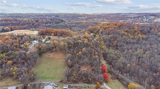 an aerial view of residential house and lake view