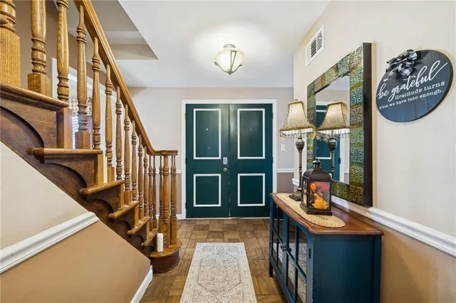 a view of living room with furniture and entryway